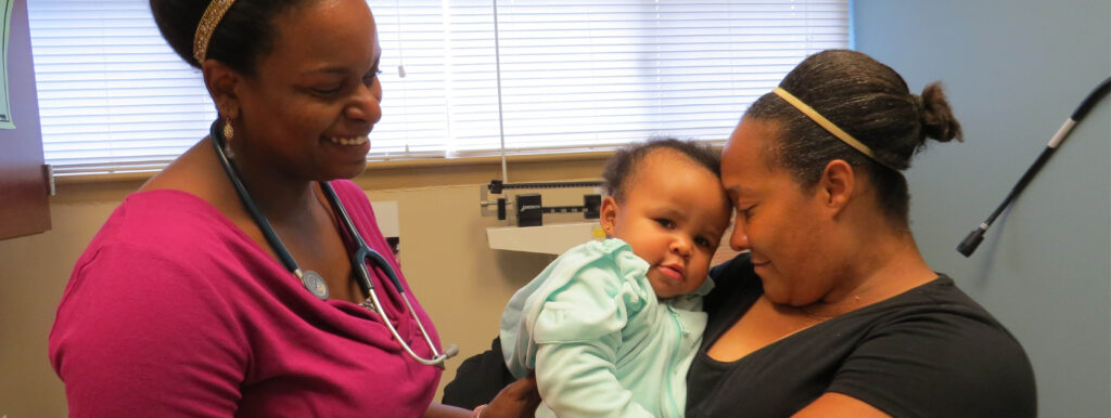 OBGYN Doctor consults with mother of a small child